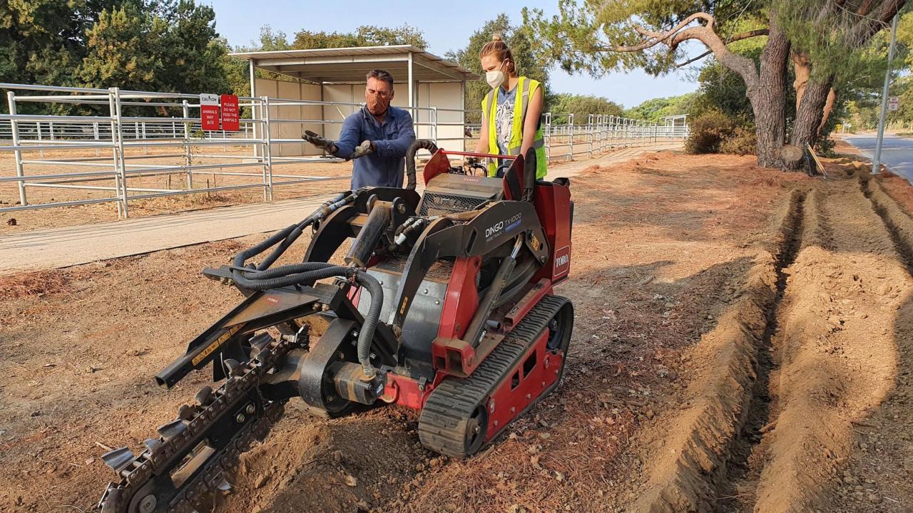 Miles Daprato and Rain Butler installing drip irrigation at Aqua Free garden site 