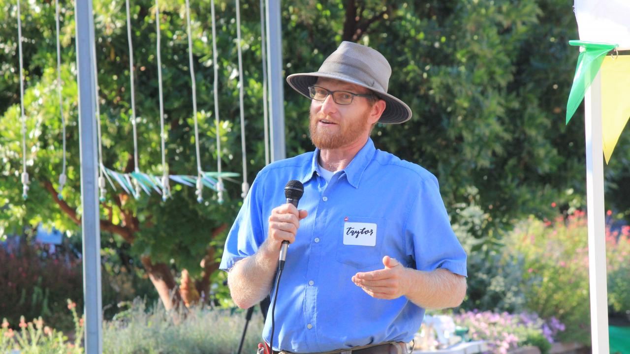 Taylor Lewis, Nursery Manager at the UC Davis Arboretum and Public Garden, talks to a crowd