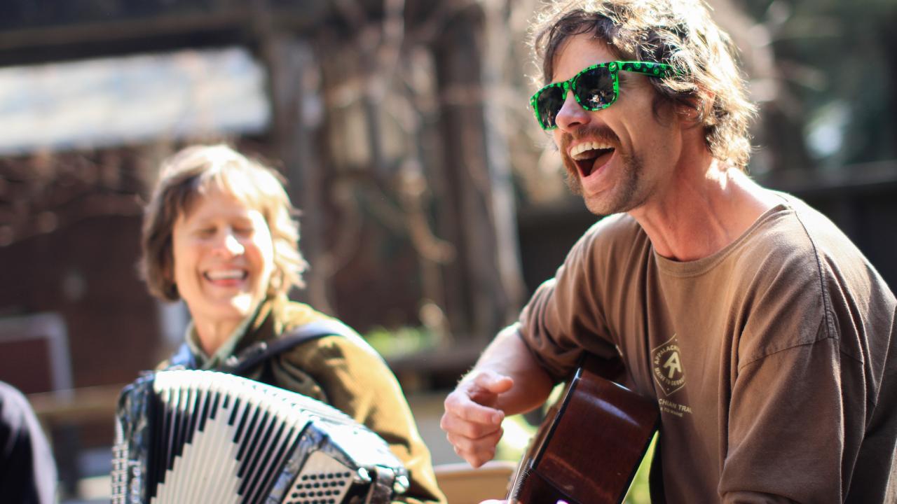 Image of the UC Davis Arboretum and Public Garden's bi-weekly folk music jam session on Wyatt Deck.