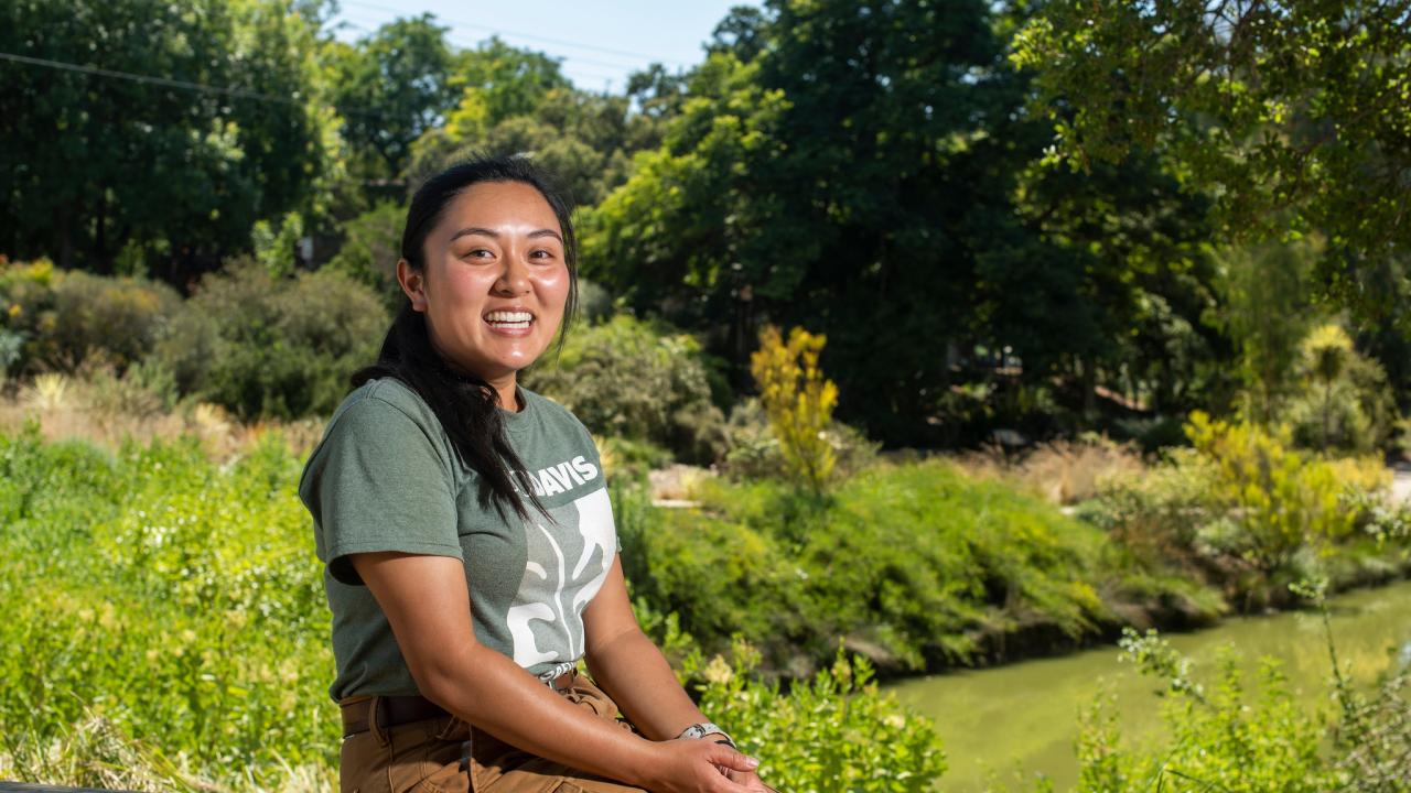 Noreen Mabini sits near the Arboretum Waterway