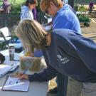 Image of individual signing up for membership with the Friends of the UC Davis Arboretum and Public Garden.