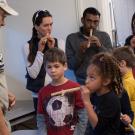 kids learning how to play the flute 