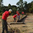 Scouts from Troop 111 work to install posts along the reserve to  protect the sensitive landscape at UC Davis Putah Creek Riparian Reserve.