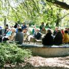 community members sitting in the peter shields oak grove 