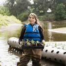 Image of waterway stewardship intern in the arboretum waterway.