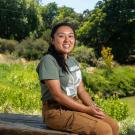 Noreen Mabini sits near the Arboretum Waterway