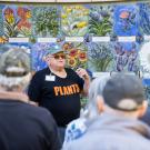 Warren speaks to a crowd in front of Nature's Gallery Court