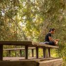 girl listening to music in the Arboretum 