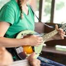 Woman playing mandolin