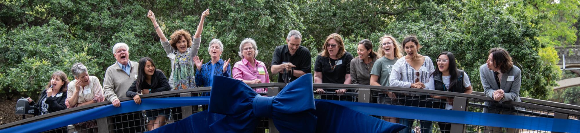 Image of donors on a bridge in the Arboretum.