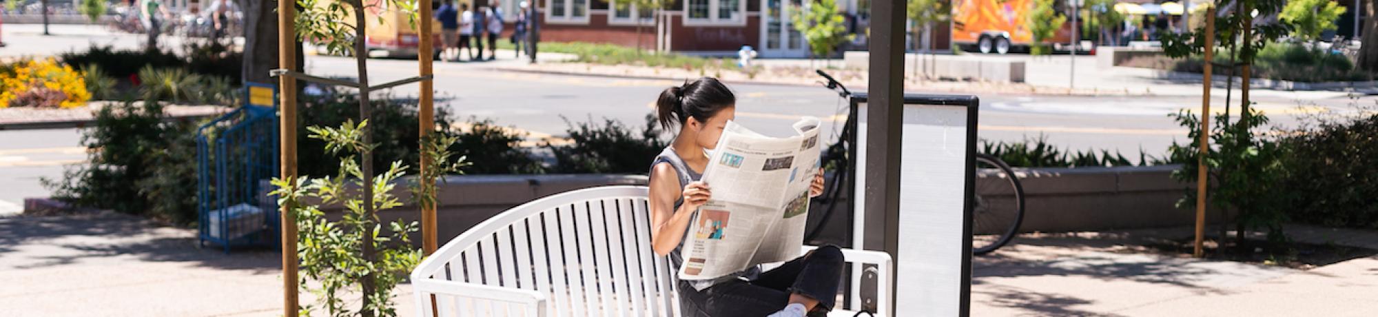 person sitting in a bench